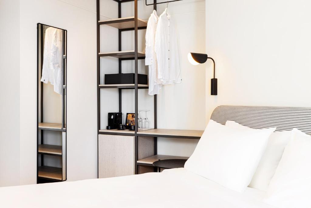 Katil atau katil-katil dalam bilik di Doryssa Lithos Hotel