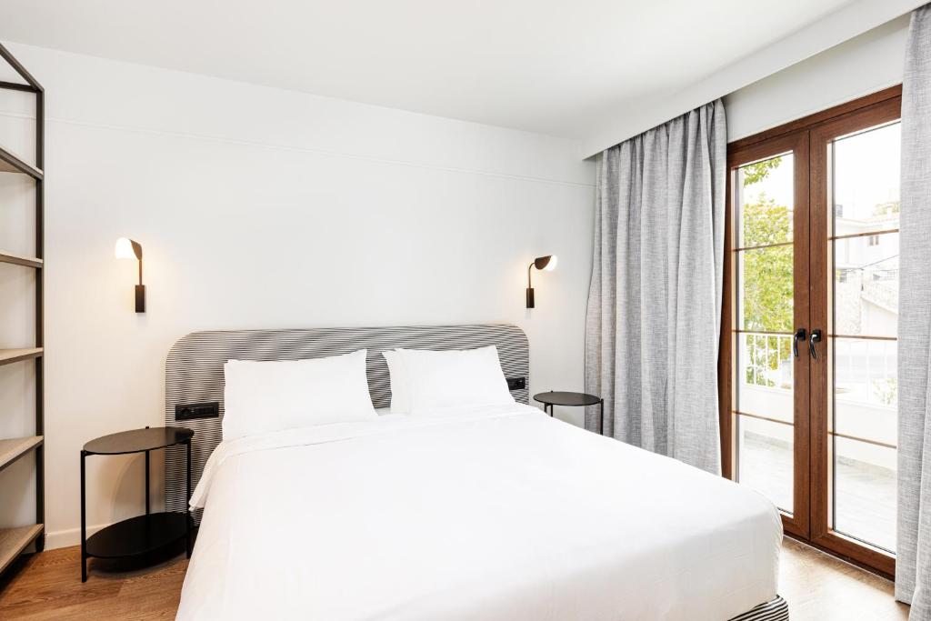Katil atau katil-katil dalam bilik di Doryssa Lithos Hotel