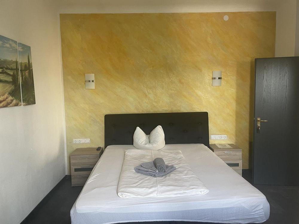 Postel nebo postele na pokoji v ubytování Etna Hotel & Ristorante