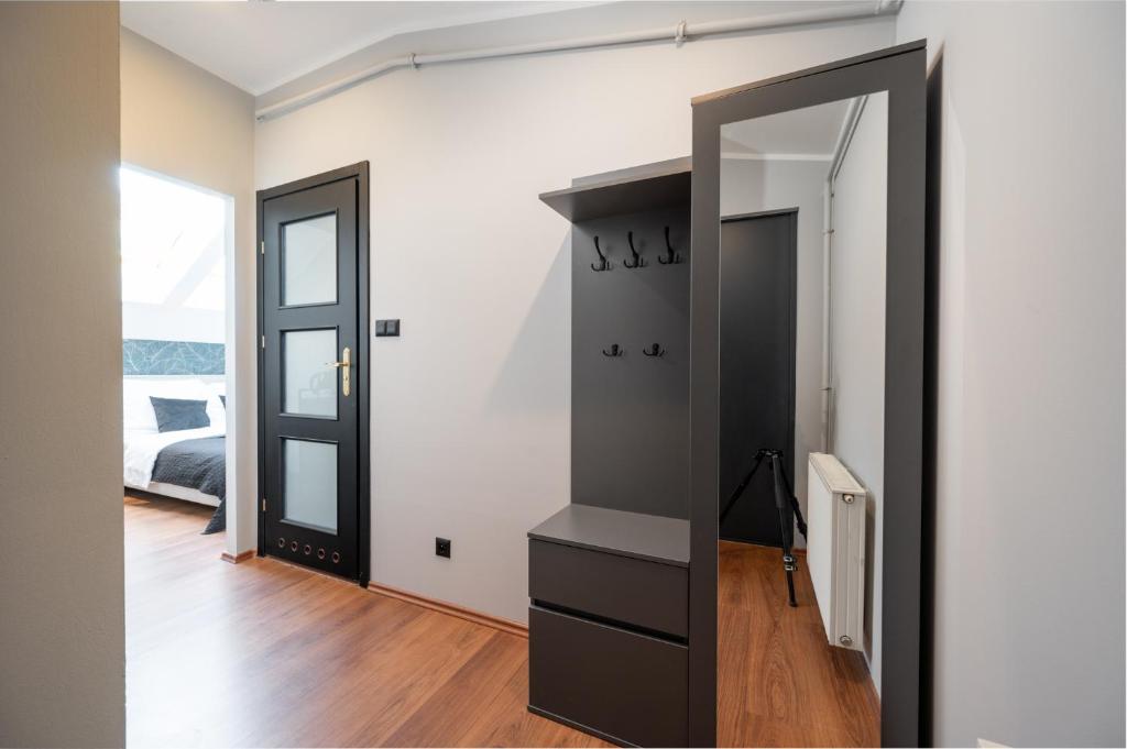 Posteľ alebo postele v izbe v ubytovaní Kościelna Loft Apartaments