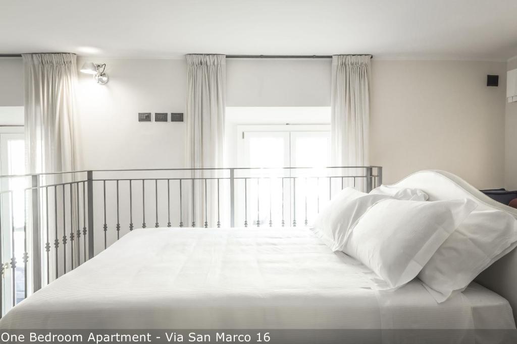 Posteľ alebo postele v izbe v ubytovaní Brera Apartments in San Marco