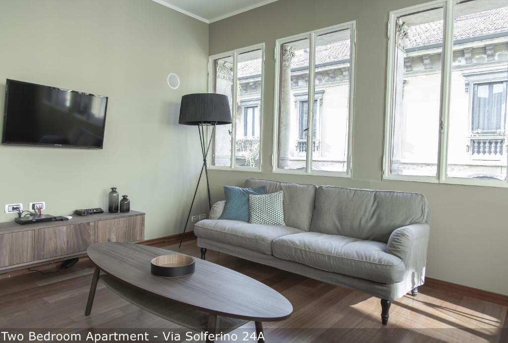 Televízia a/alebo spoločenská miestnosť v ubytovaní Brera Apartments in San Marco