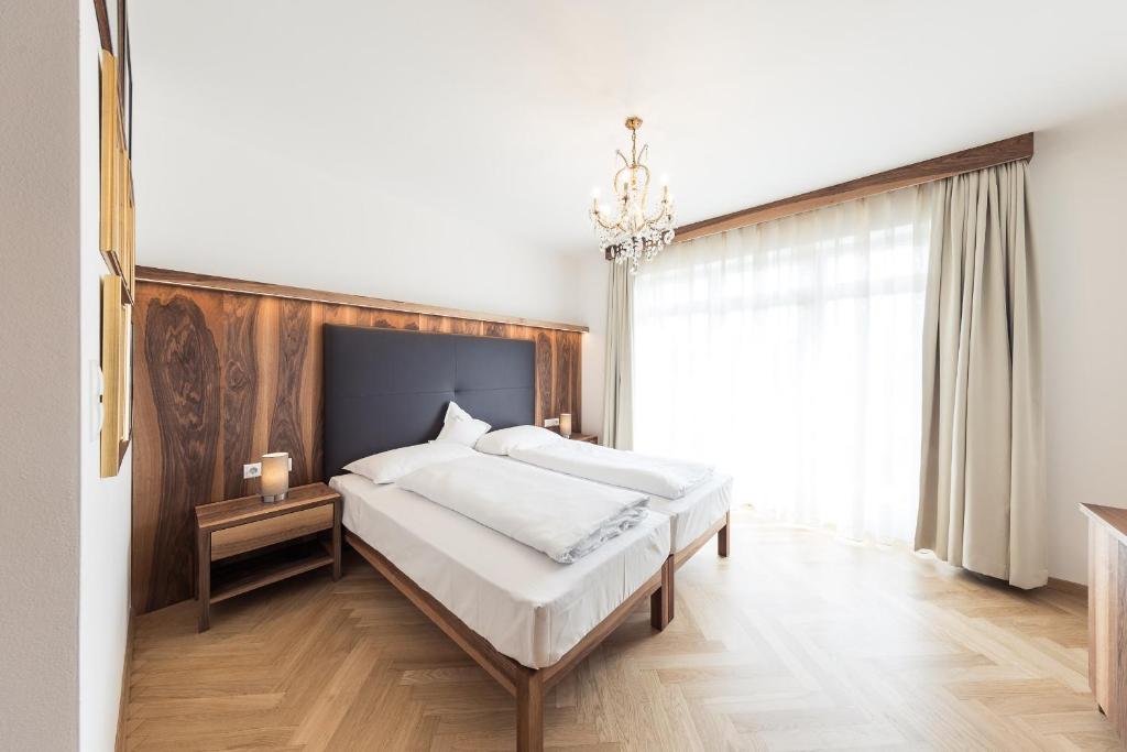 Postel nebo postele na pokoji v ubytování Romantik Hotel Jagdhof