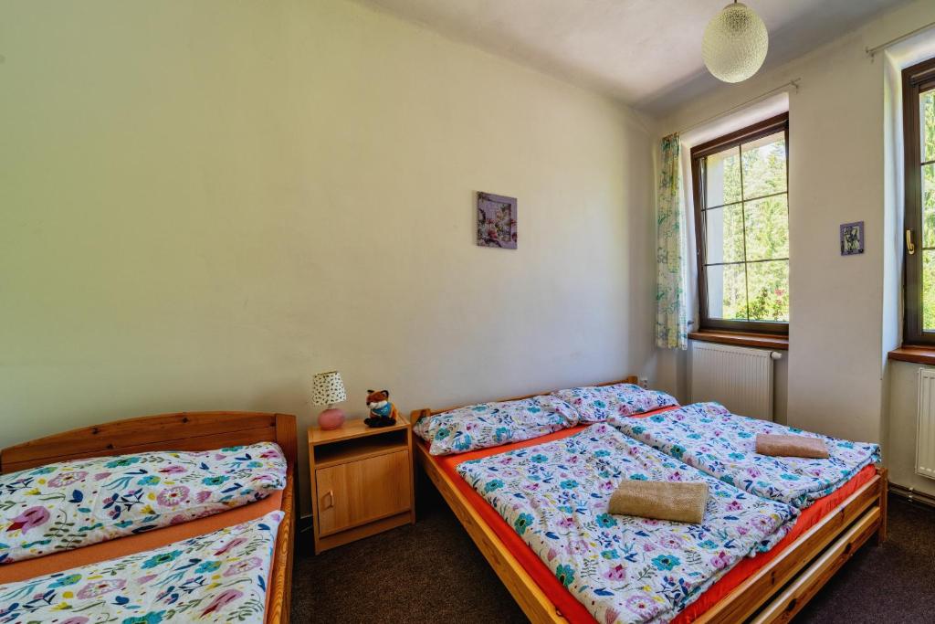 Postel nebo postele na pokoji v ubytování Penzion Šumavous
