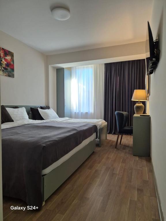 Postel nebo postele na pokoji v ubytování Hotel Asa