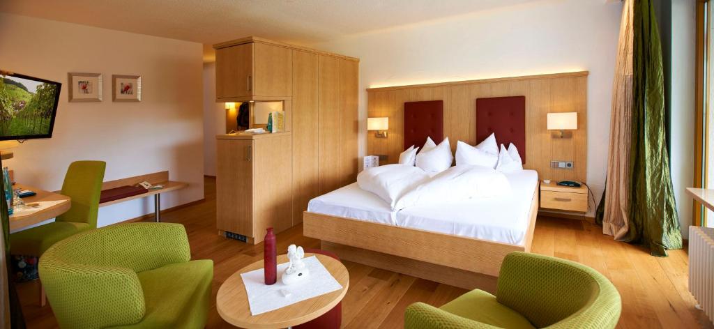 Postel nebo postele na pokoji v ubytování Wellnesshotel Ludinmühle