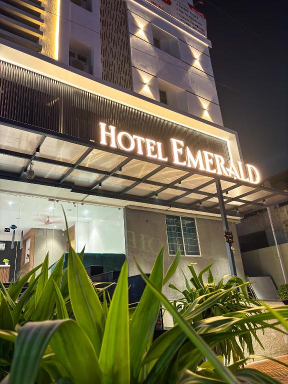 a hotel emergency sign in front of a building at Hotel Emerald in Visakhapatnam