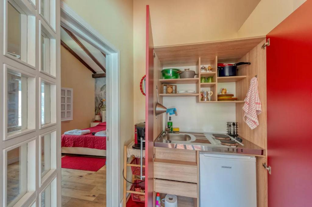Kuchyň nebo kuchyňský kout v ubytování Villa Paradiso