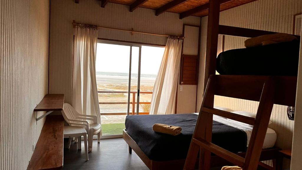 Postel nebo postele na pokoji v ubytování Punta Ngritos wind & surf