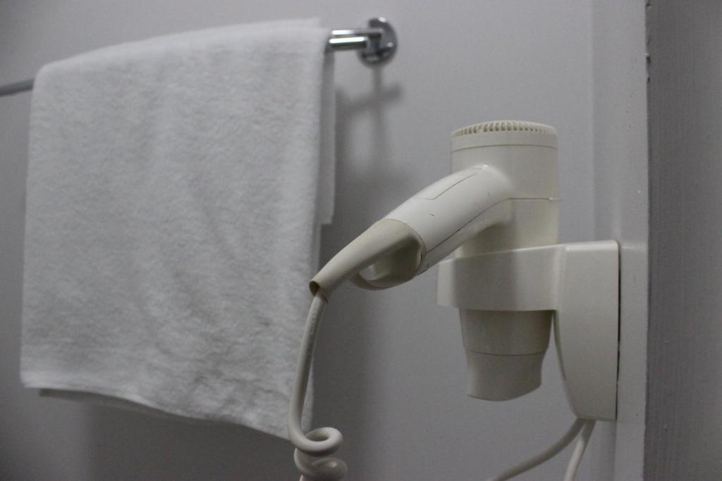 Koupelna v ubytování De Paris Hotel