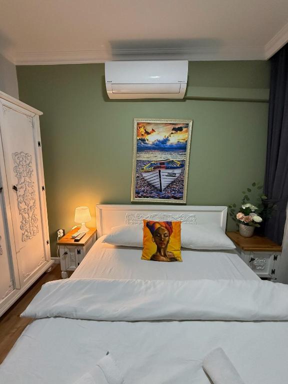 Postel nebo postele na pokoji v ubytování GV Suites Galata