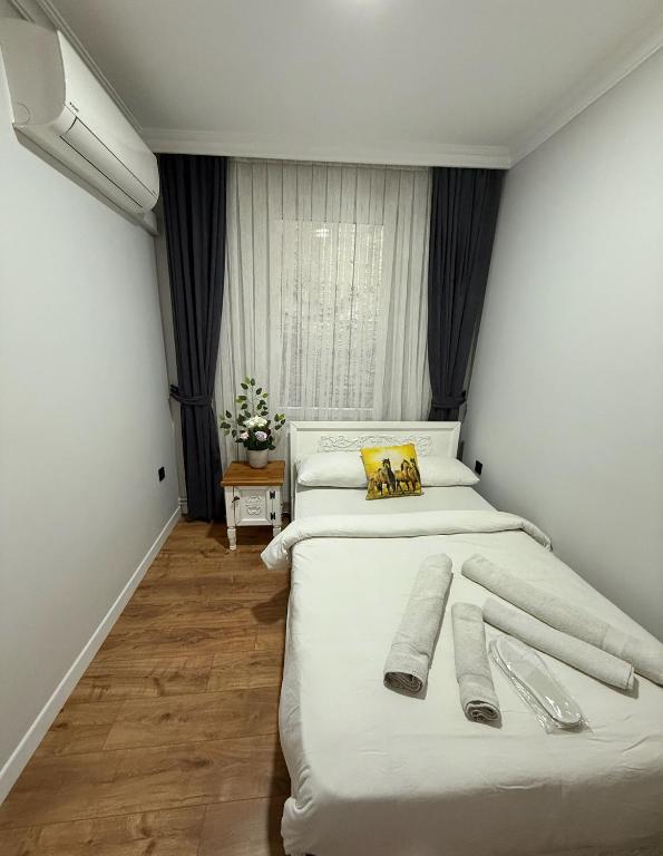 Postel nebo postele na pokoji v ubytování GV Suites Galata