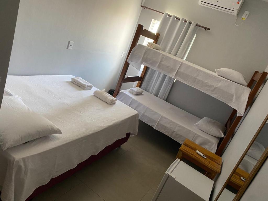 Postel nebo postele na pokoji v ubytování Deck Pousada