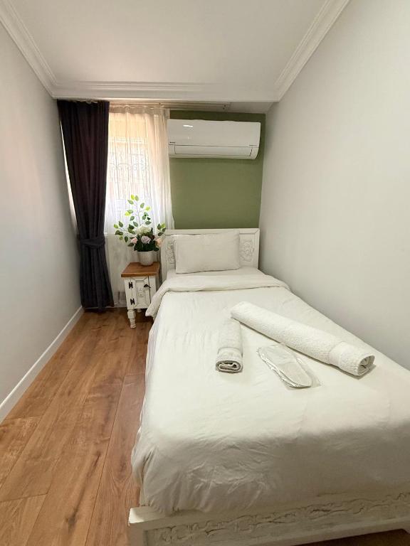 Postel nebo postele na pokoji v ubytování GV Suites Galata