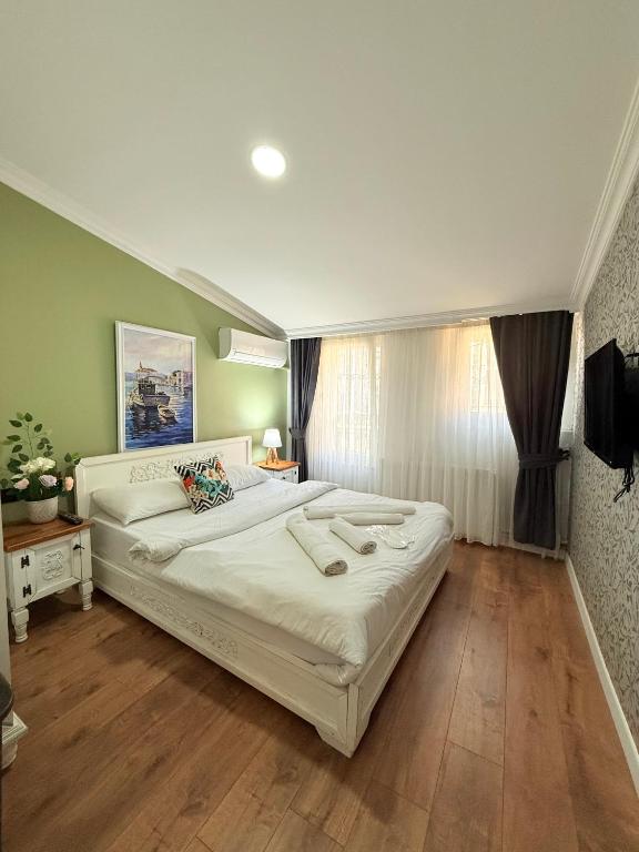 Postel nebo postele na pokoji v ubytování GV Suites Galata