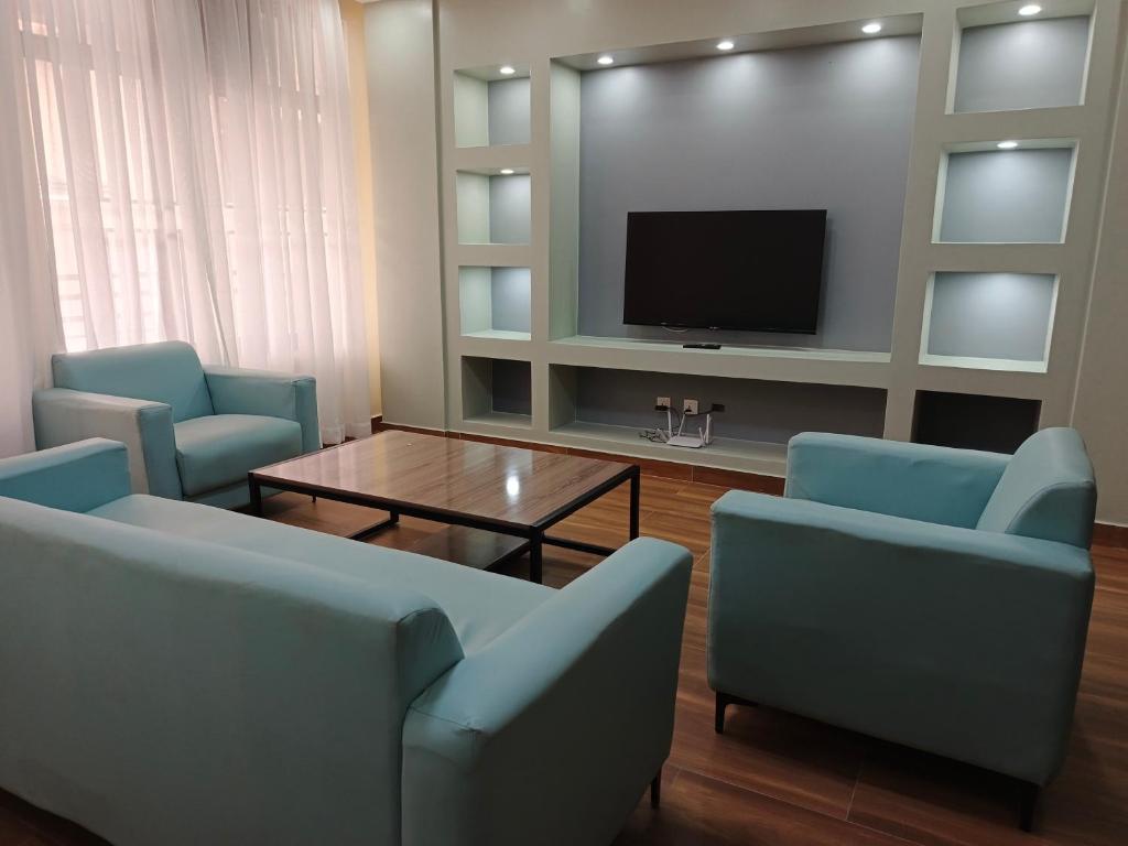 TV a/nebo společenská místnost v ubytování Jikoni Hotel