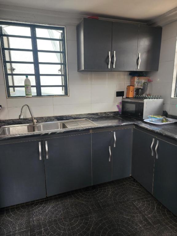 Kuchyň nebo kuchyňský kout v ubytování JJ Apartment