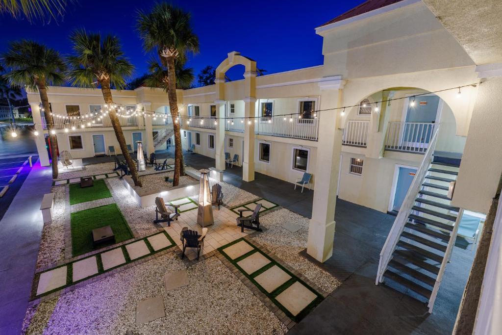 an aerial view of a building with palm trees and lights at Dunes Inn & Suites - Tybee Island in Tybee Island