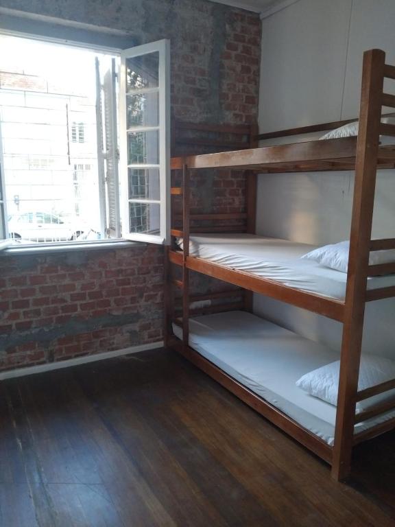 Postel nebo postele na pokoji v ubytování Nick Hostel Cidade Baixa- Próx à Redenção, Opinião,Araújo Viana, João Alfredo,