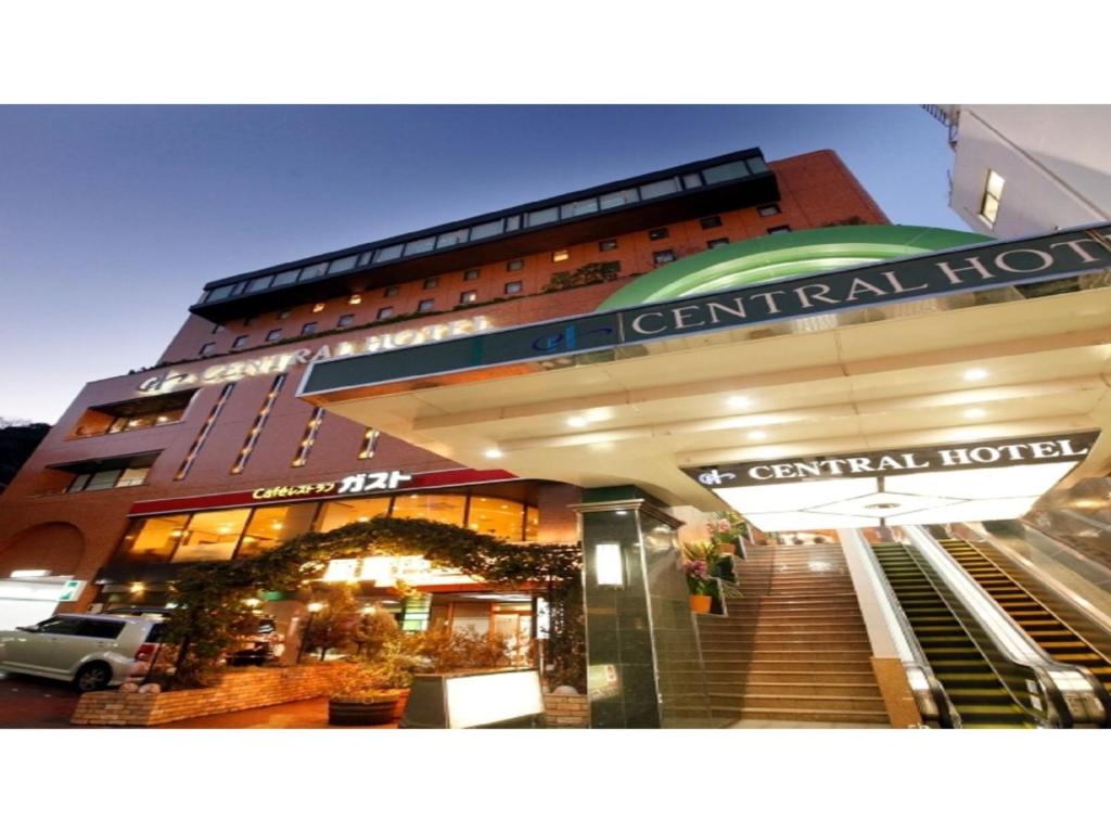 a large hotel with stairs leading up to it at Central Hotel - Vacation STAY 99766v in Kusugaurachō