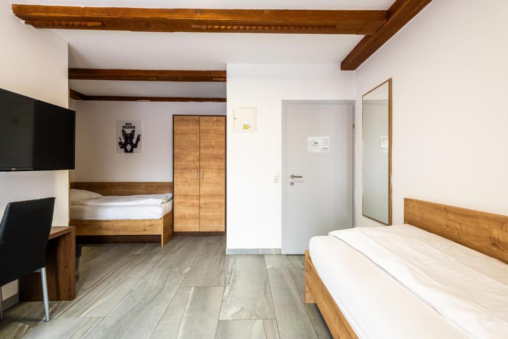Postel nebo postele na pokoji v ubytování Wels Inn Hotel