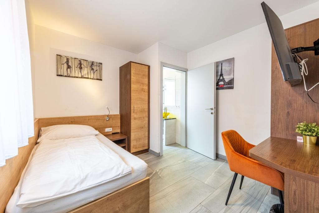 Postel nebo postele na pokoji v ubytování Wels Inn Hotel