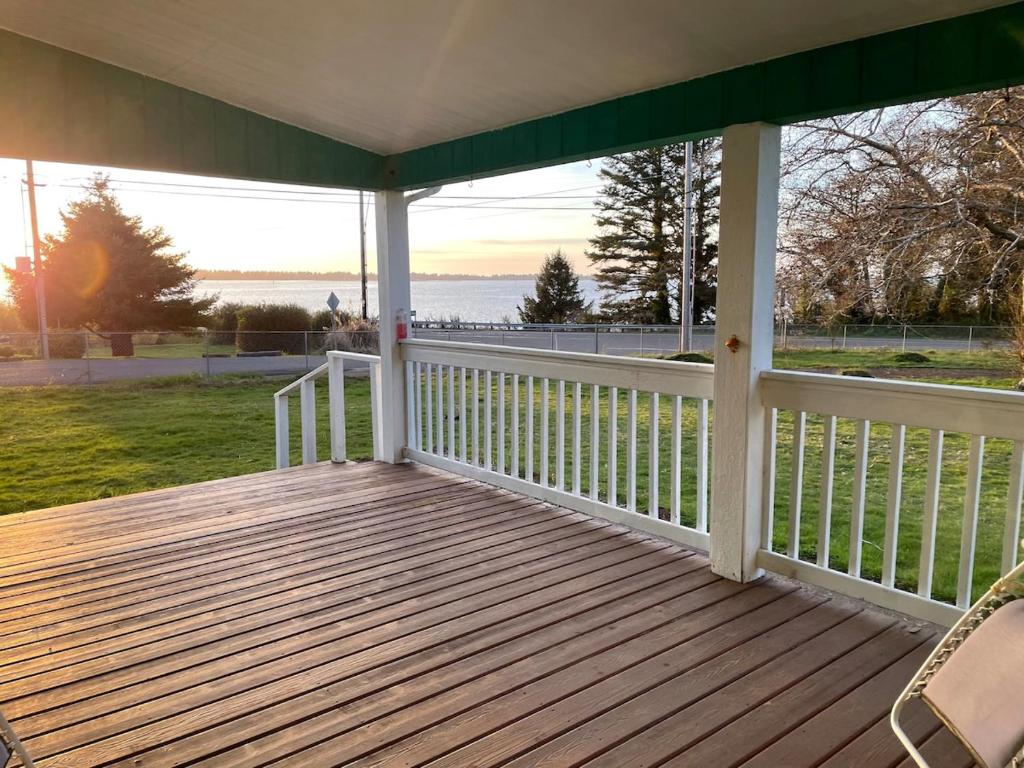 a screened porch with a view of the water at Rosie's Surf Shack in Aberdeen