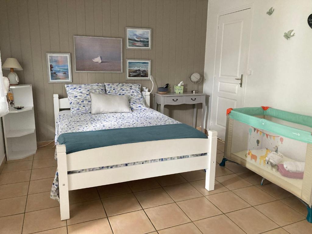 Postel nebo postele na pokoji v ubytování T2 Ti Joe Au cœur de Guadeloupe