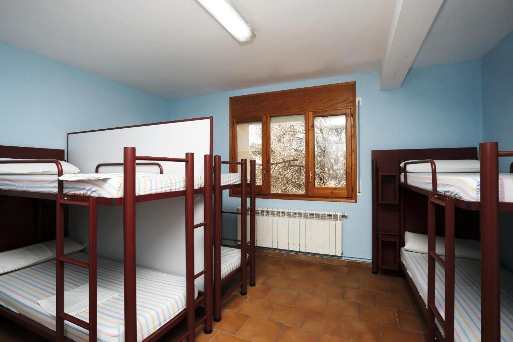 Postel nebo postele na pokoji v ubytování Alberg Tremp Xanascat
