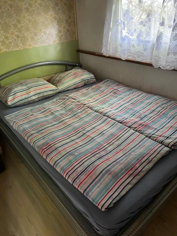 Postel nebo postele na pokoji v ubytování Mobilheimy Fofo