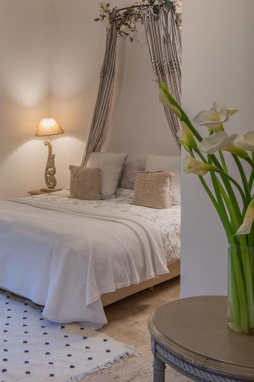 Postel nebo postele na pokoji v ubytování Villa Paschmina