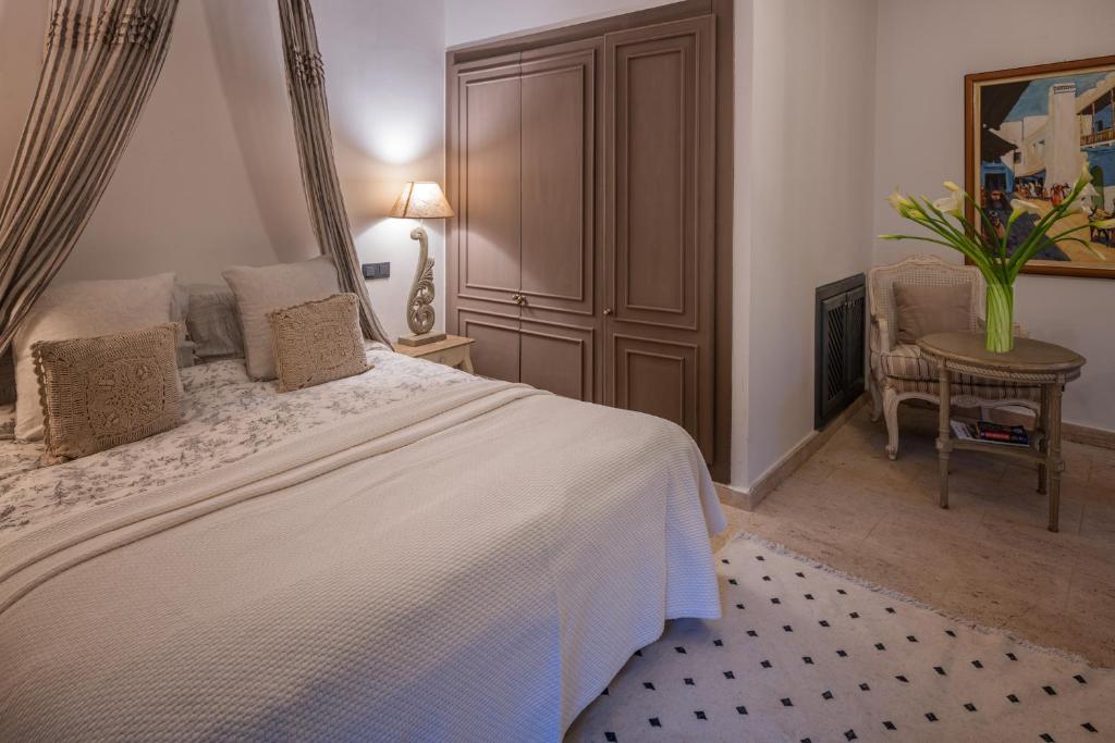 Postel nebo postele na pokoji v ubytování Villa Paschmina
