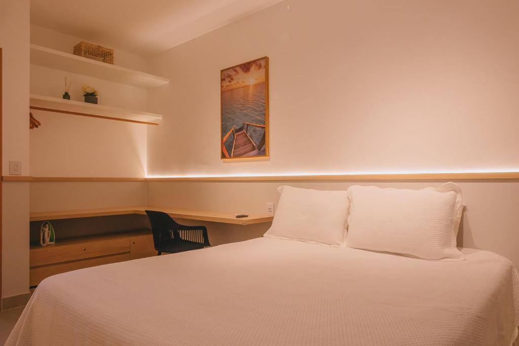 Postel nebo postele na pokoji v ubytování Novíssimo com Varanda Gourmet 10 min a pé da praia