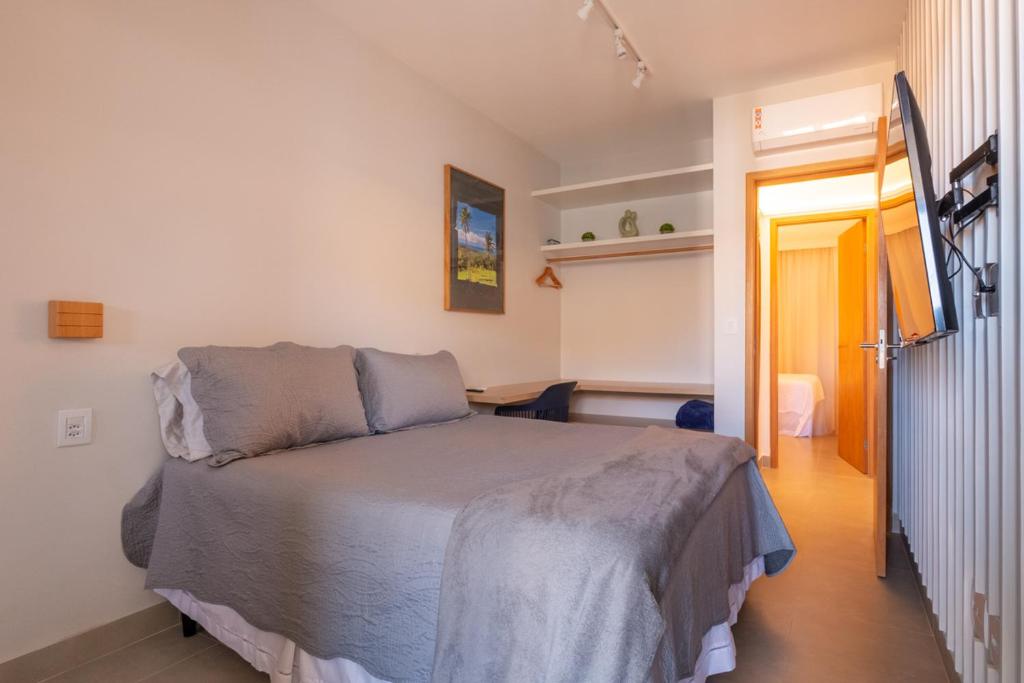Postel nebo postele na pokoji v ubytování Novíssimo com Varanda Gourmet 10 min a pé da praia