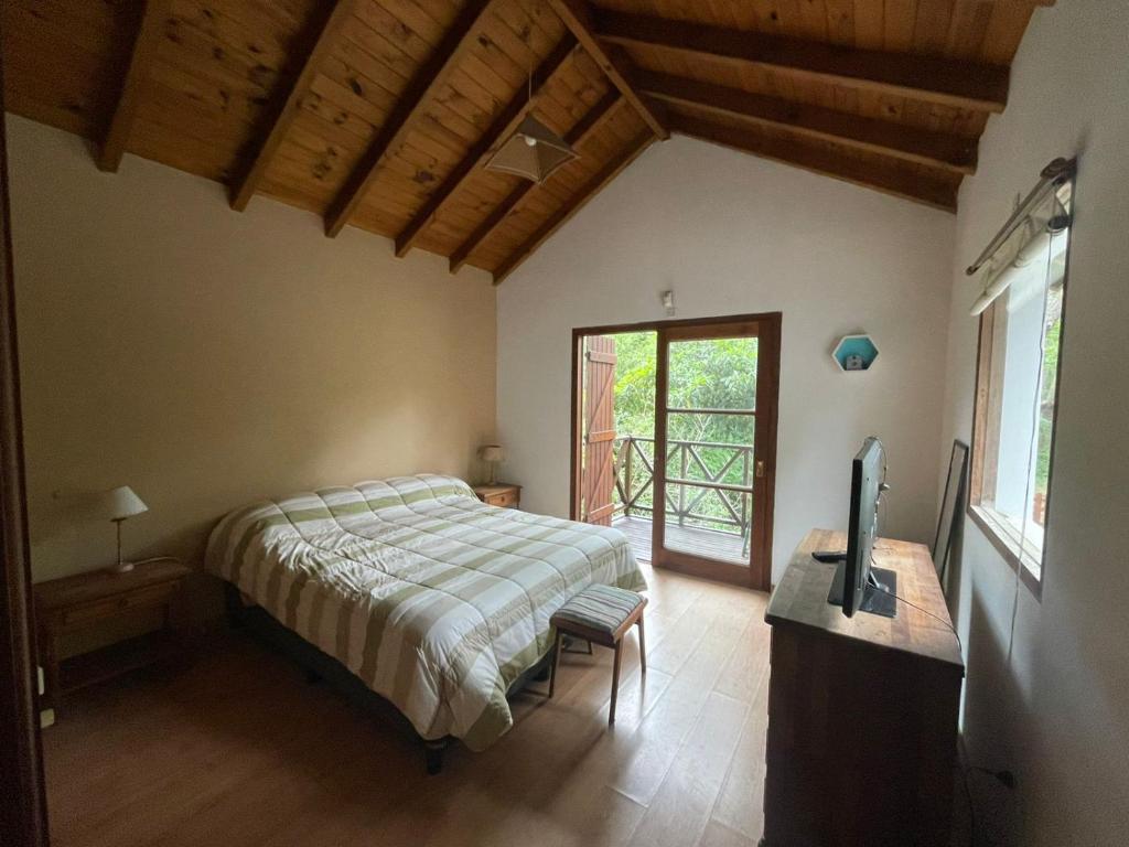 En eller flere senge i et værelse på Casa Bere