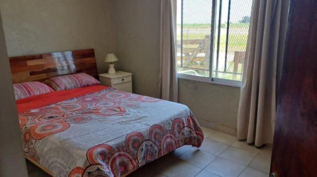 Una cama o camas en una habitación de Nova Camet
