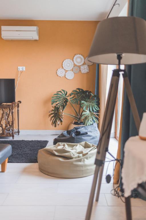 a lamp in a living room with a table at Fraga`s House - Douro e Natureza in Coura