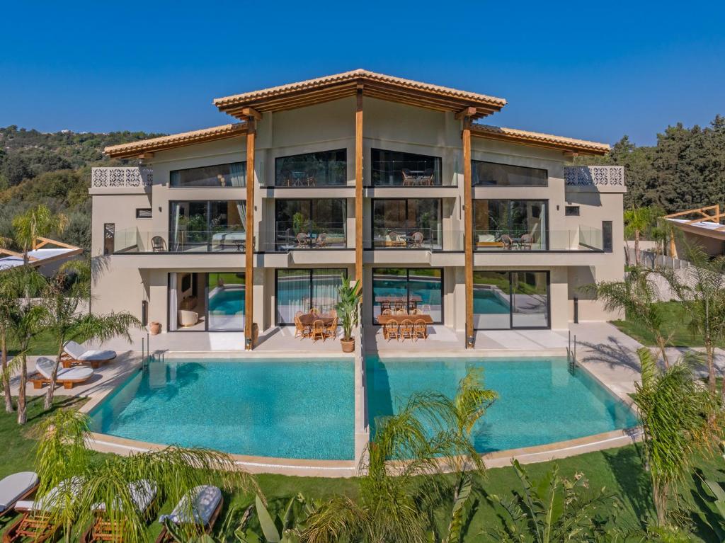 an aerial view of a house with a swimming pool at Vadis Luxury Villa Rhodes in Koskinou