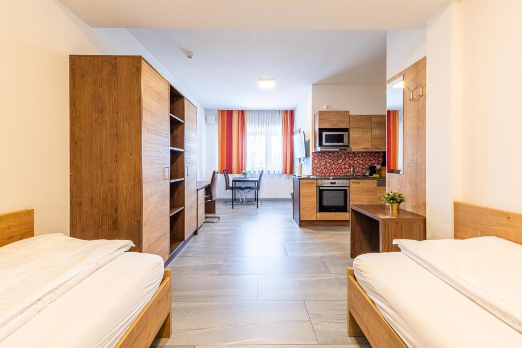 Postel nebo postele na pokoji v ubytování Wels Inn Hotel