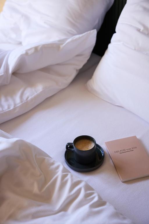 Postel nebo postele na pokoji v ubytování Hotel UND - smart alpine stay