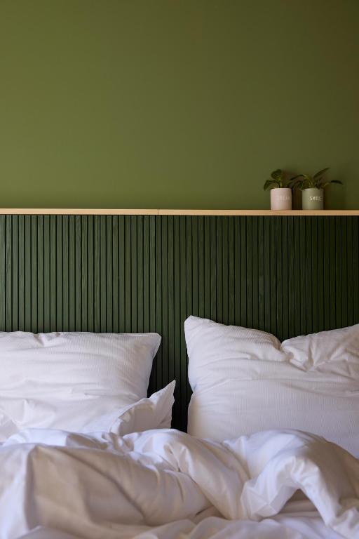 Postel nebo postele na pokoji v ubytování Hotel UND - smart alpine stay