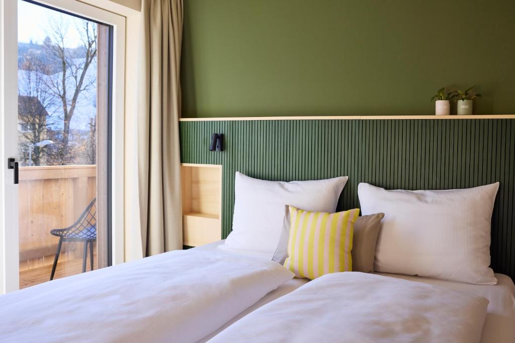 Postel nebo postele na pokoji v ubytování Hotel UND - smart alpine stay