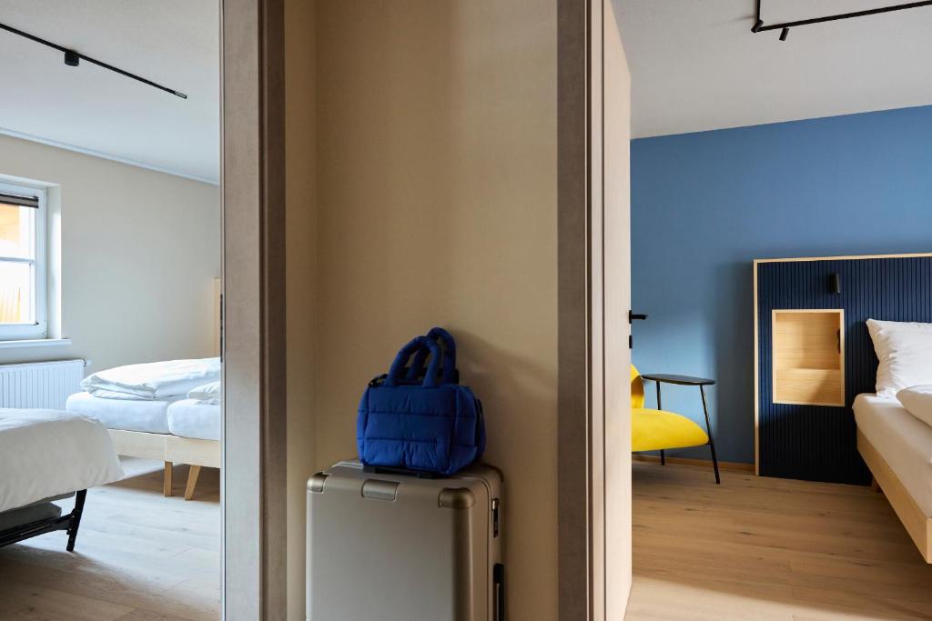Postel nebo postele na pokoji v ubytování Hotel UND - smart alpine stay