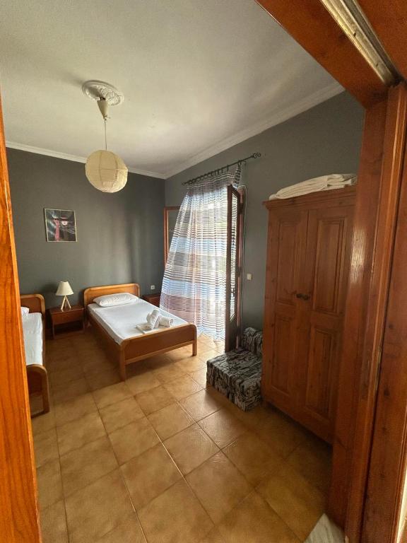Postel nebo postele na pokoji v ubytování EVA APARTMENT
