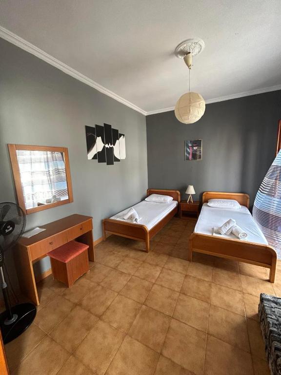 Postel nebo postele na pokoji v ubytování EVA APARTMENT