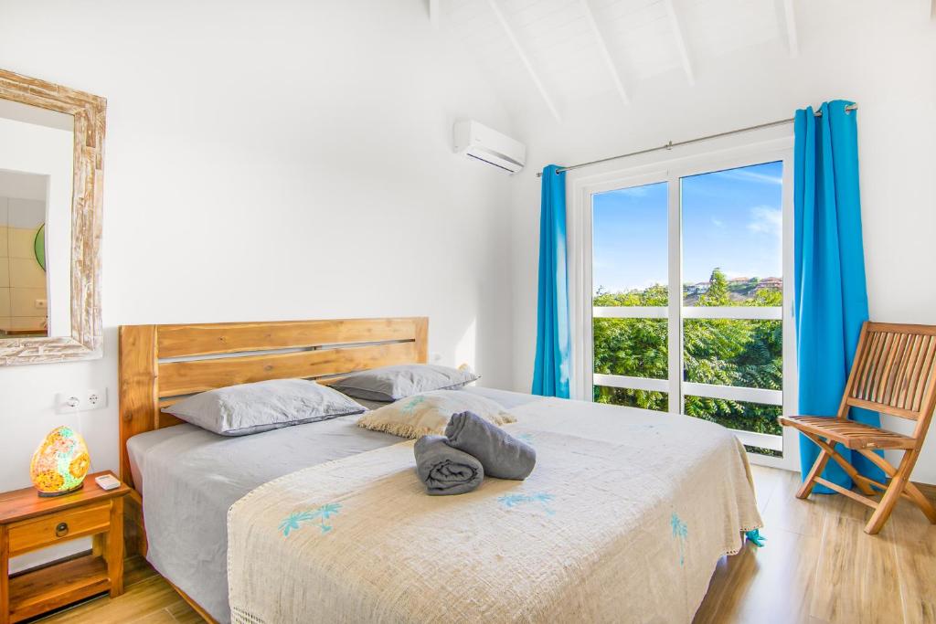 Postel nebo postele na pokoji v ubytování Kakina Lodges Jan Thiel