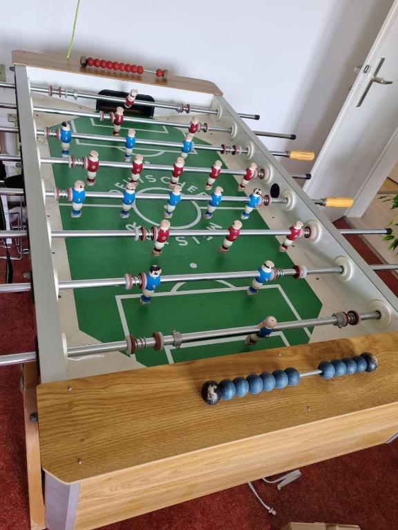 a snooker table with a group of people at Tischfussball Quartier Köln-Niehl in Cologne