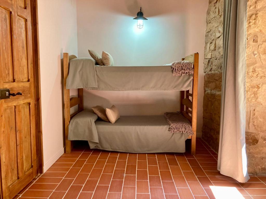 Postel nebo postele na pokoji v ubytování Cal Carlà de Belltall