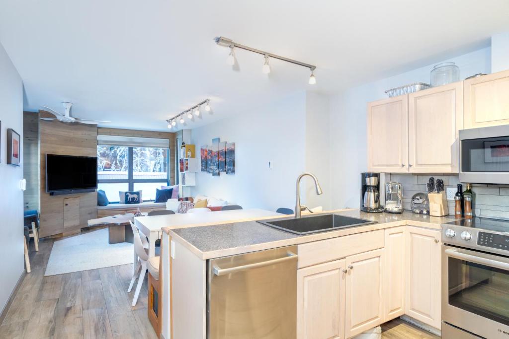 a kitchen with a sink and a counter top at One block walk to gondola, ski lockers downstairs, River Trail close by! in Telluride