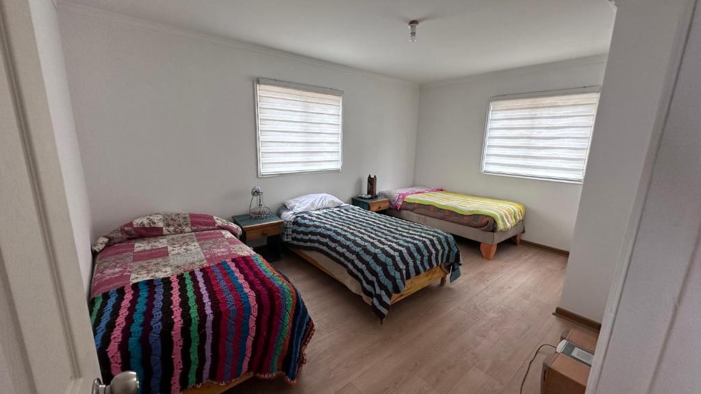 Postel nebo postele na pokoji v ubytování Cabaña H & M